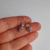 Silver pine cone drop earrings on handmade recycled 925 sterling silver ear wires by The Tiny Tree Frog Jewellery