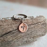 Hand stamped copper Aries zodiac symbol key ring, handmade by The Tiny Tree Frog Jewellery