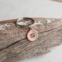 Hand stamped copper Cancer star sign keyring, hand made by The Tiny Tree Frog Jewellery
