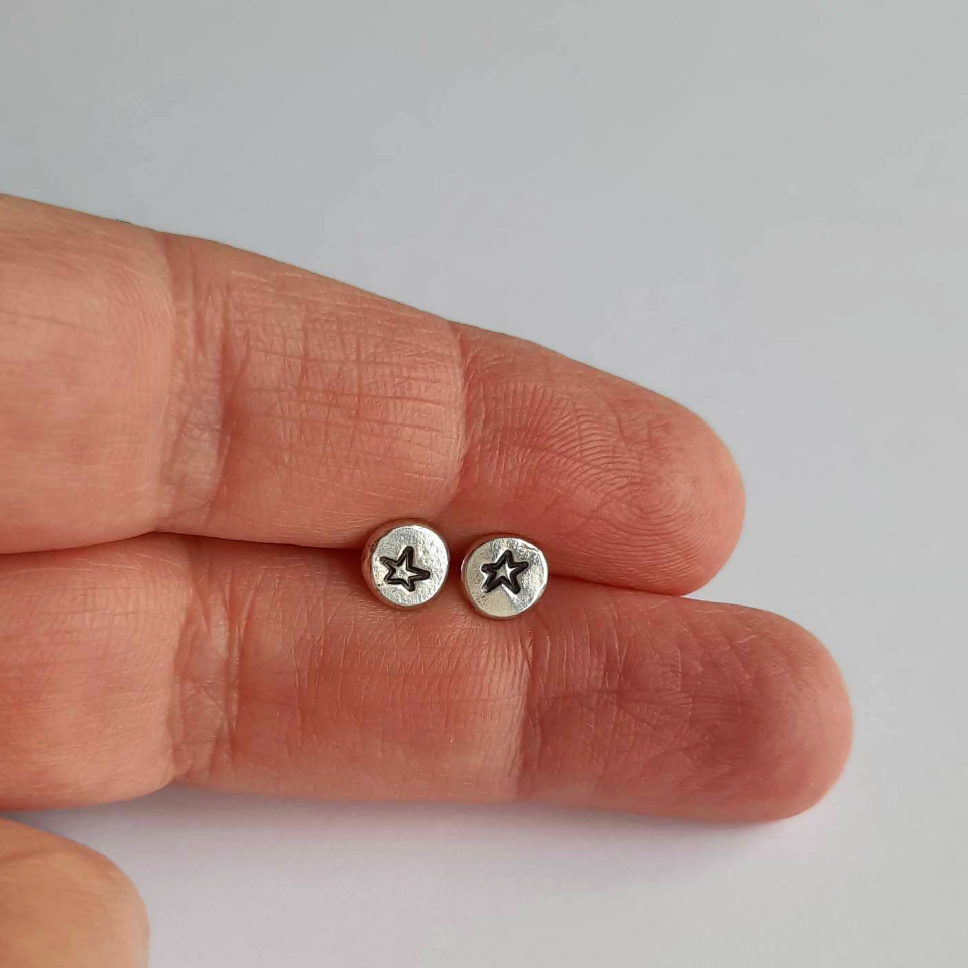 Dainty sterling silver celestial star studs, artisan made by The Tiny Tree Frog Jewellery