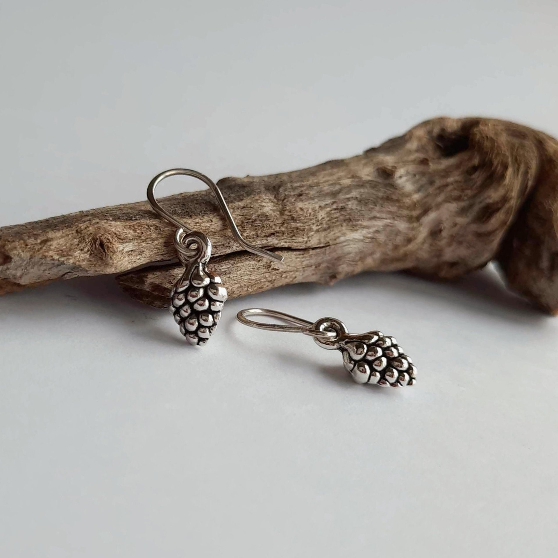 Silver pine cone drop earrings on handmade recycled 925 sterling silver ear wires by The Tiny Tree Frog Jewellery