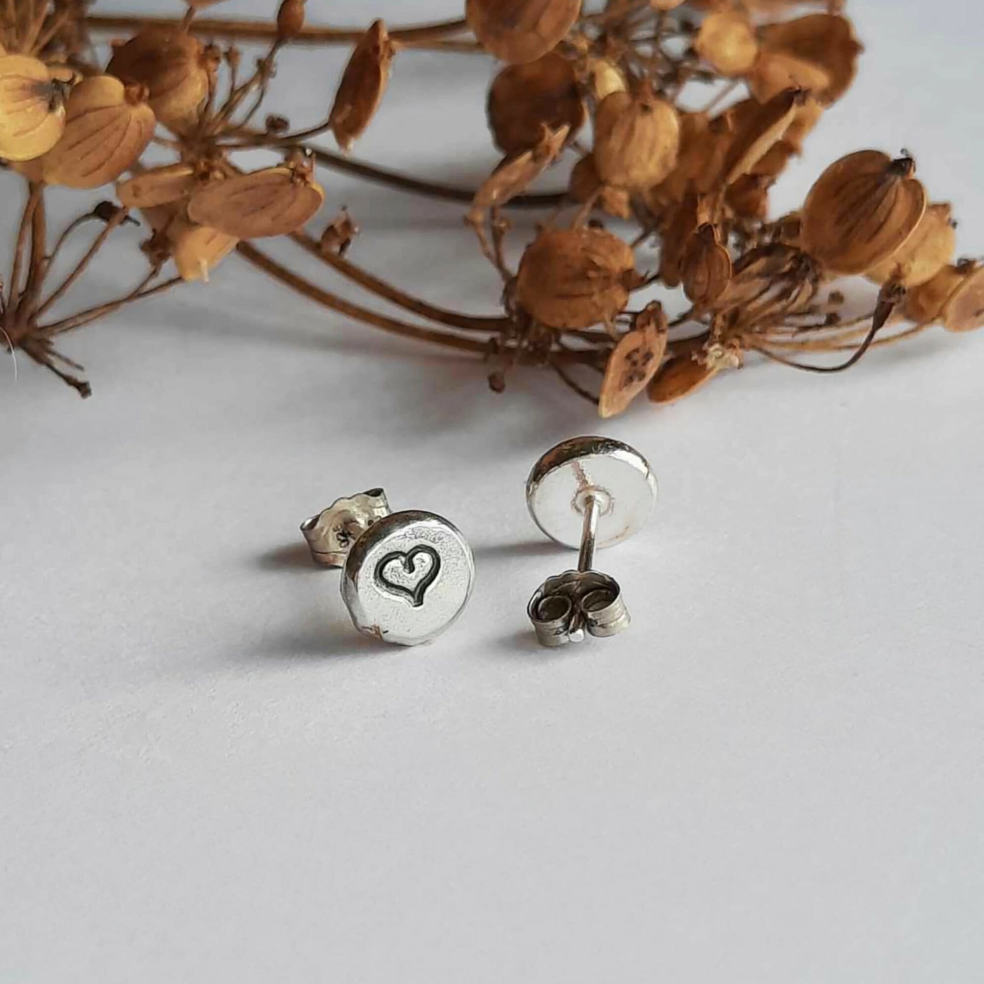 Cute recycled sterling silver love heart stud earrings, handmade by The Tiny Tree Frog Jewellery
