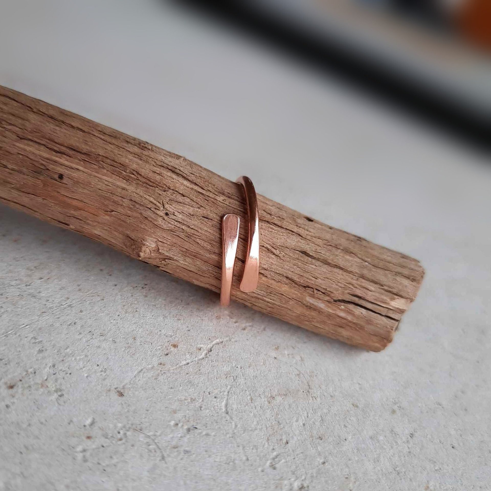 Dainty, adjustable copper wraparound ring, hand crafted by The Tiny Tree Frog Jewellery
