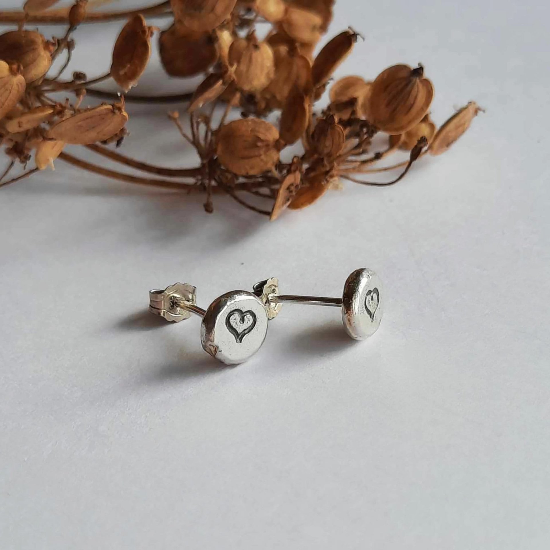 Recycled sterling silver hand stamped love heart stud earrings, hand crafted by The Tiny Tree Frog Jewellery