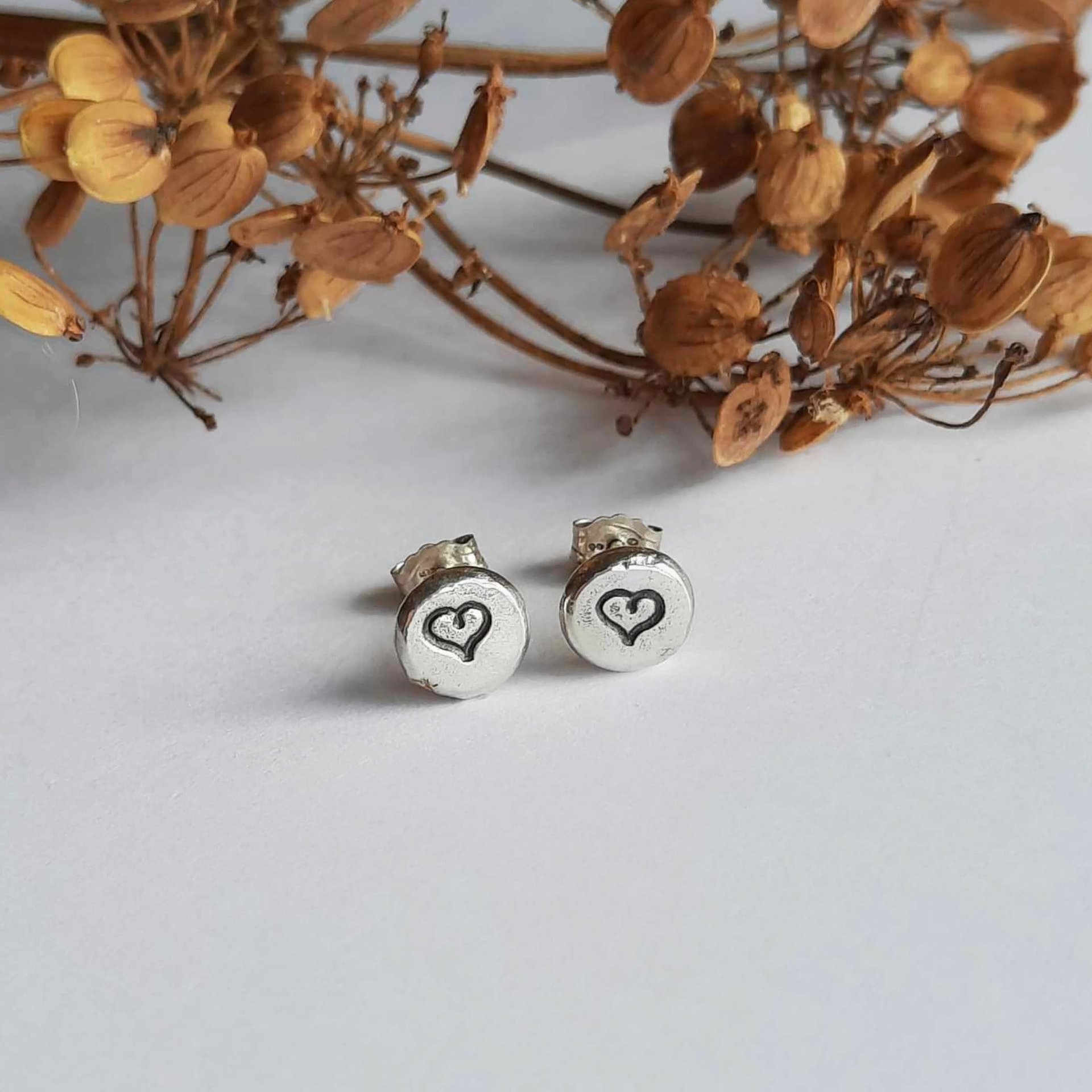 Dainty little recycled sterling silver love heart stud earrings, handcrafted by The Tiny Tree Frog Jewellery