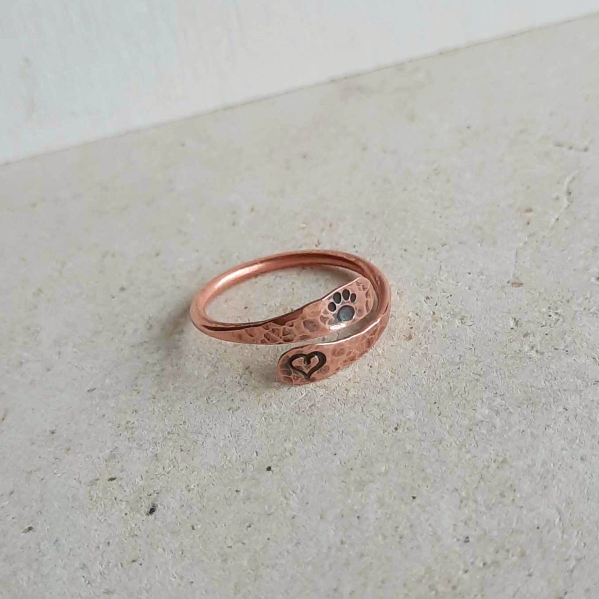 Handstamped copper paw print and love heart adjustable wraparound band ring, artisan made by The Tiny Tree Frog Jewellery