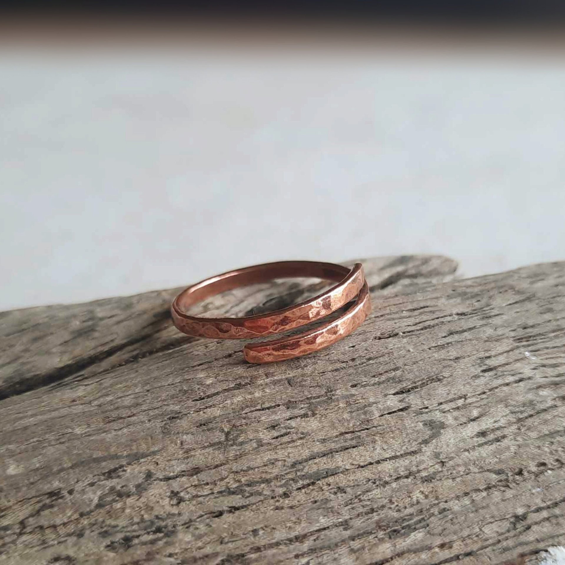 Thin, hammer textured copper wrap ring, hand made by The Tiny Tree Frog Jewellery