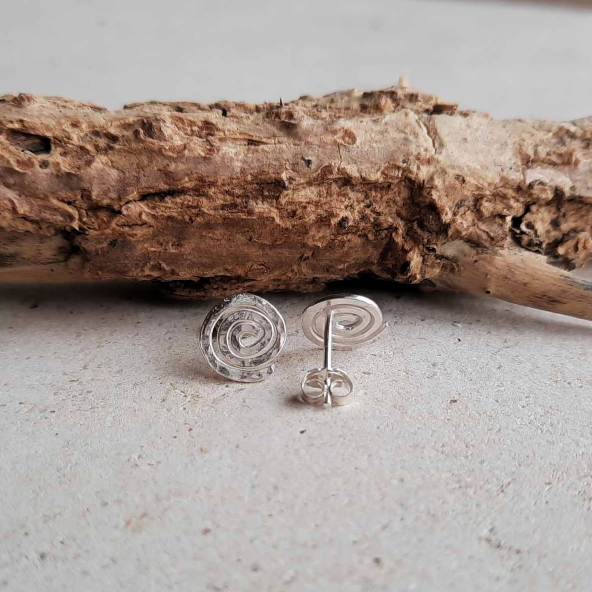 Eco friendly recycled and hammered sterling silver spiral studs, handcrafted by The Tiny Tree Frog Jewellery