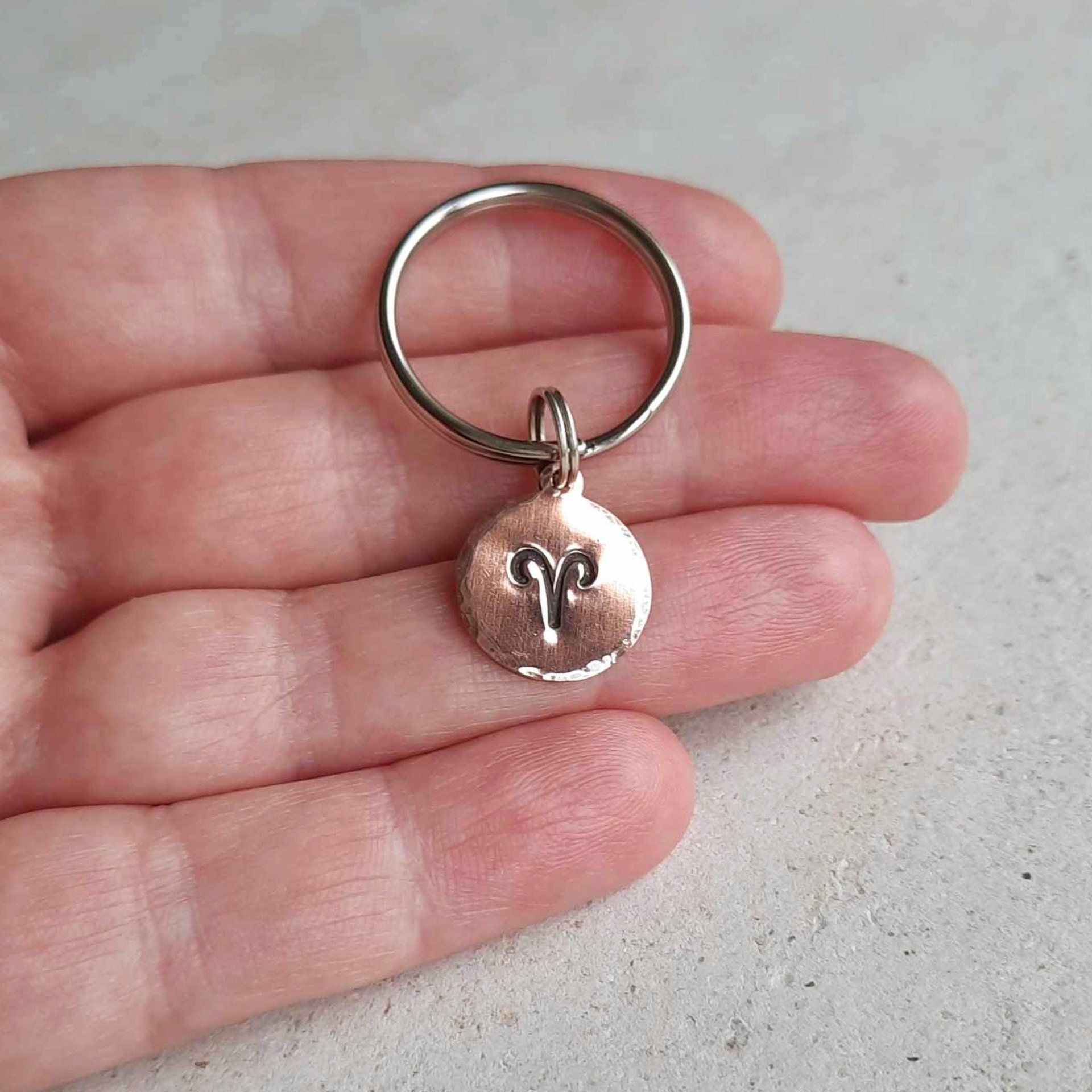 Handstamped copper Aries star sign keyring, hand made by The Tiny Tree Frog Jewellery