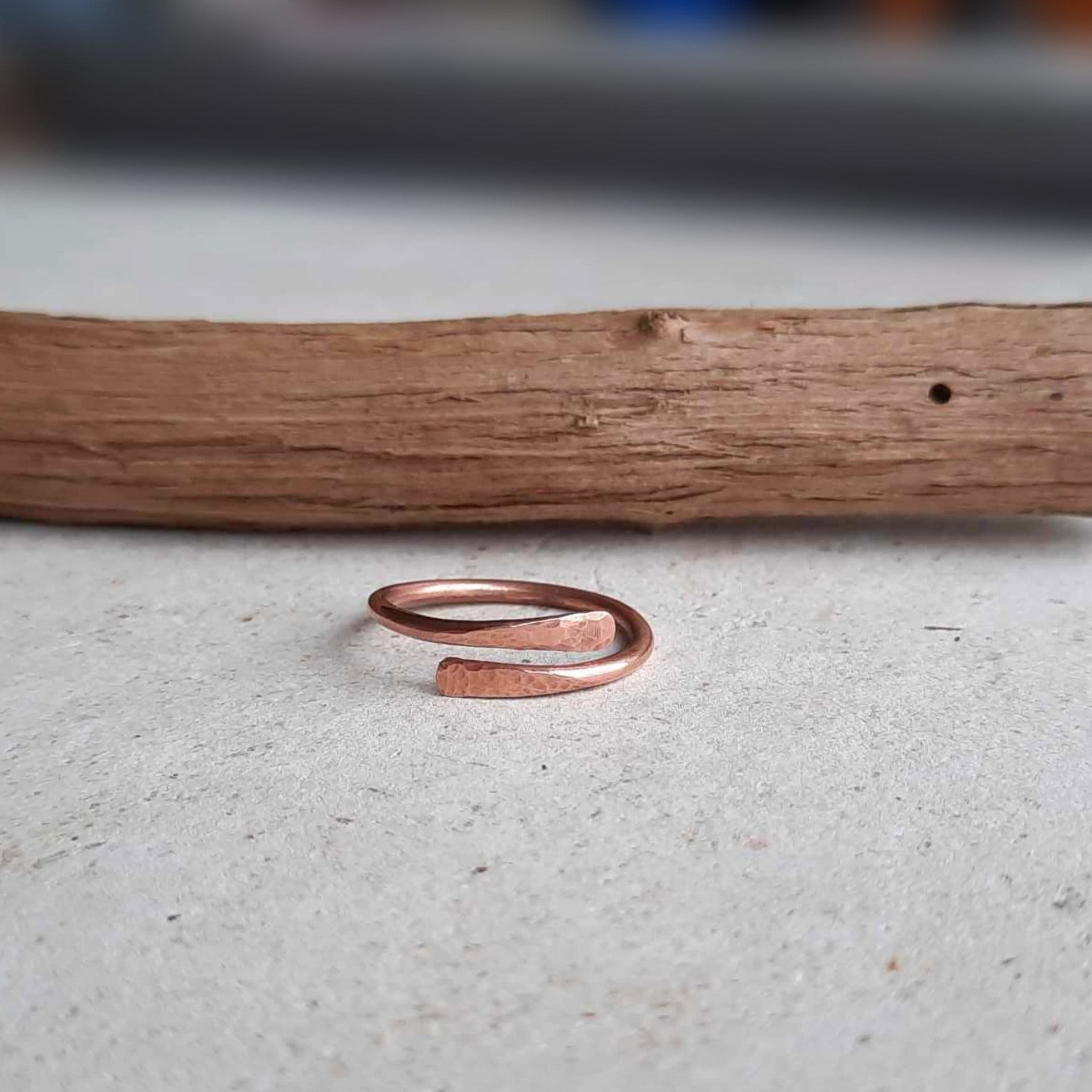 Boho style thin copper crossover band ring, hand crafted by The Tiny Tree Frog Jewellery