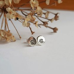 Recycled sterling silver paw print stud earrings, handmade by The Tiny Tree Frog Jewellery
