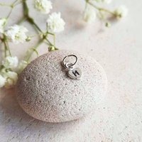 Tiny sterling silver heart charm hand stamped with a personalised initial
