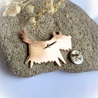 Rear view of the handcrafted copper scruffy terrier dog brooch with the brooch pin open
