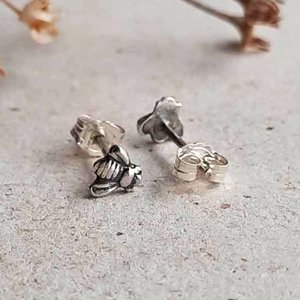 Tiny 5mm fine silver bee stud earrings shown with sterling silver posts and butterfly backs