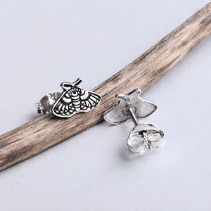 Sterling silver moth stud earrings showing the front and back with sterling silver butterfly backs
