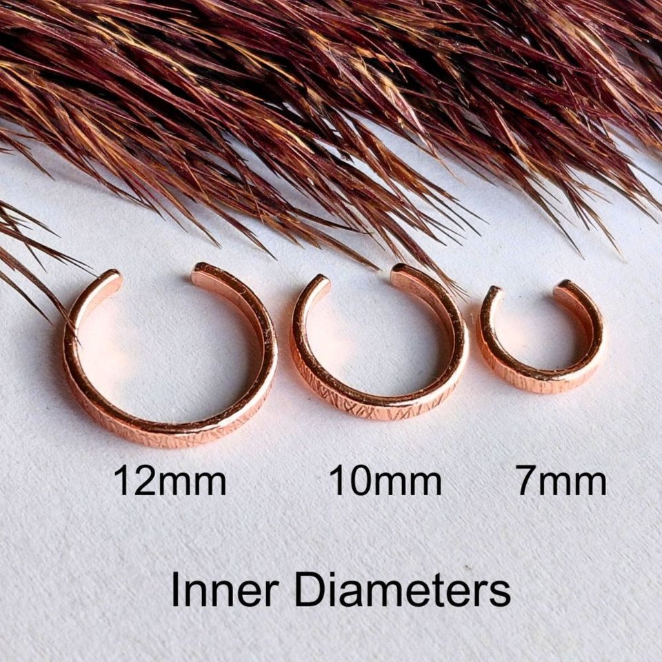Three copper ear cuffs showing 7mm, 10mm and 12mm inner diameter size options