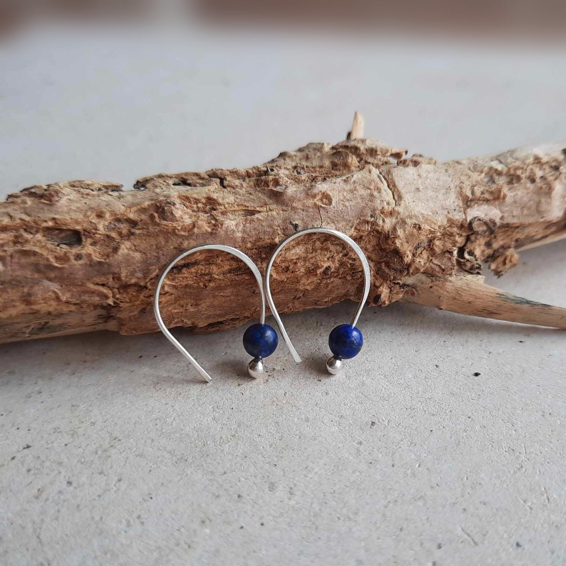 Minimal sterling silver and lapis lazuli gemstone oval open hoop threader earrings, hand forged by The Tiny Tree Frog Jewellery