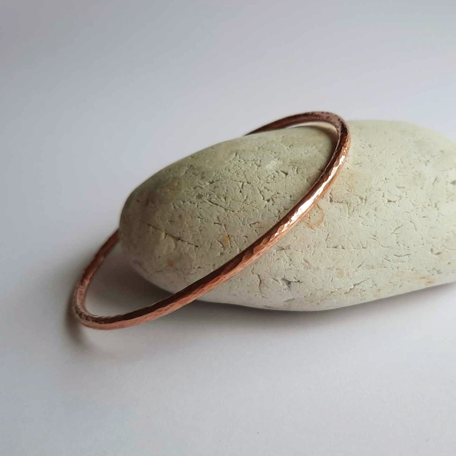 Hammered pure copper slim bangle 7th anniversary gift, handcrafted by The Tiny Tree Frog Jewellery