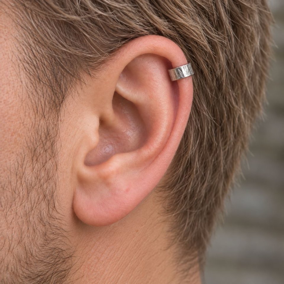 Hammered sterling silver ear cuff shown being worn on the helix of a man's ear